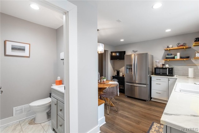 4830 Transit Rd, Cheektowaga, NY 14043 - bathroom featuring vanity, toilet, recessed lighting, wood finished floors, and backsplash