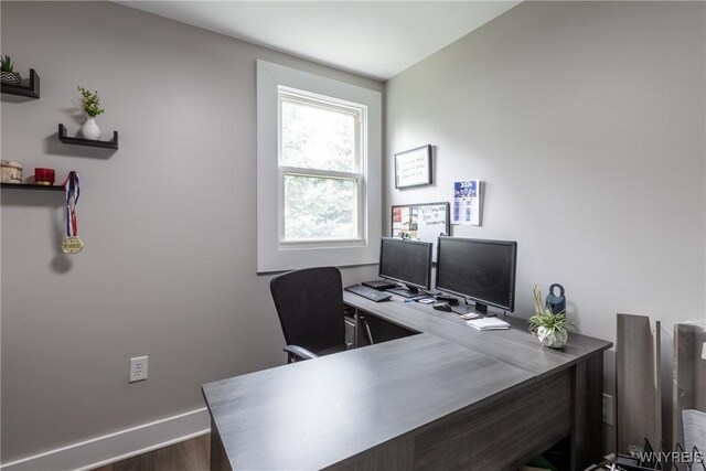 4830 Transit Rd, Cheektowaga, NY 14043 - home office featuring baseboards and dark wood-style flooring