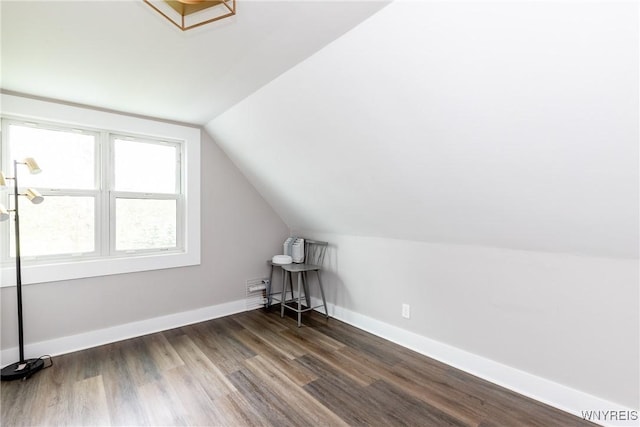 4830 Transit Rd, Cheektowaga, NY 14043 - additional living space with vaulted ceiling, dark wood-style floors, and baseboards