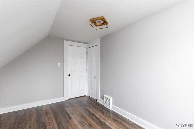 4830 Transit Rd, Cheektowaga, NY 14043 - bonus room with dark wood finished floors, baseboards, and lofted ceiling
