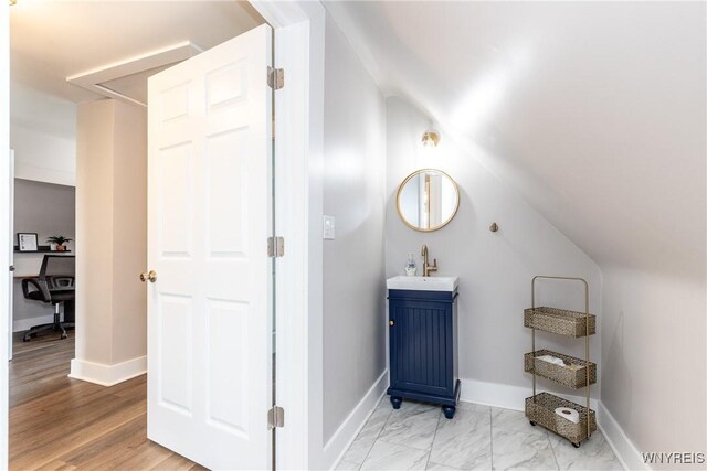 4830 Transit Rd, Cheektowaga, NY 14043 - bathroom featuring baseboards, vanity, and marble finish floors