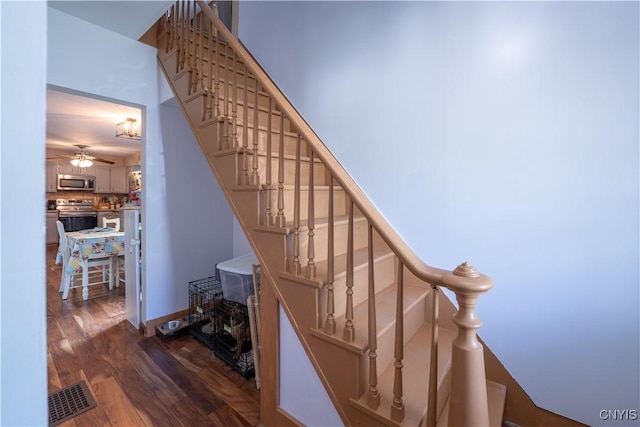 401 Palmer St, Frankfort, NY 13340 - stairs with wood finished floors and a ceiling fan