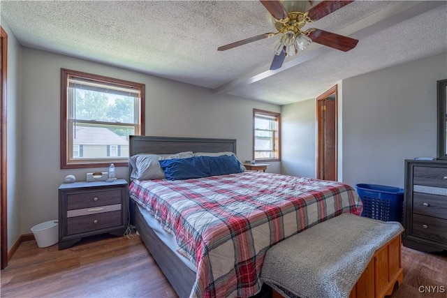401 Palmer St, Frankfort, NY 13340 - bedroom with wood finished floors, a textured ceiling, a ceiling fan, and baseboards