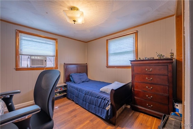 401 Palmer St, Frankfort, NY 13340 - bedroom featuring multiple windows, wood finished floors, cooling unit, and ornamental molding