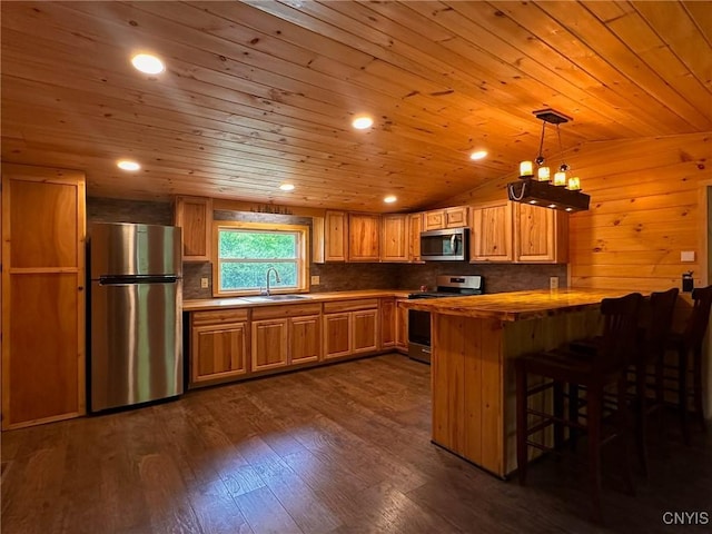 3742 State Route 8, Ohio, NY 13324 - kitchen with stainless steel appliances, a sink, wooden ceiling, a peninsula, and a breakfast bar