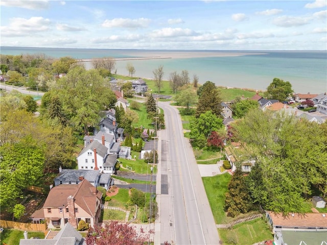 aerial perspective of suburban area with a nearby body of water