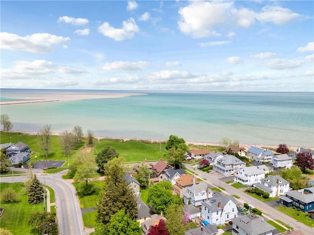 aerial perspective of suburban area featuring a large body of water