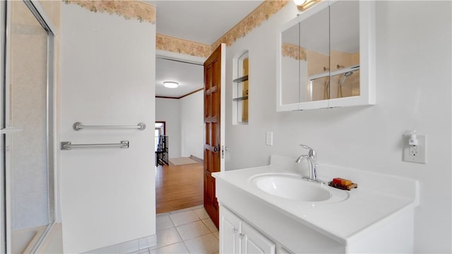 bathroom with tile patterned floors and vanity