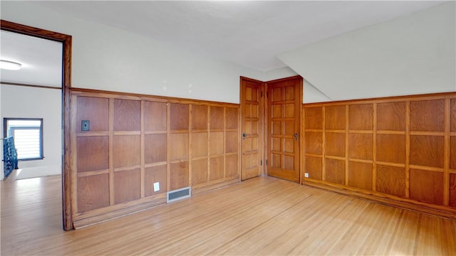 empty room featuring wood finished floors