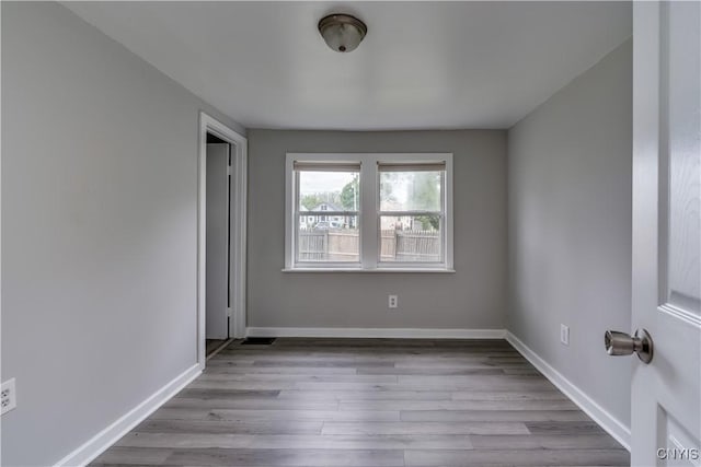 124 Haven St, Watertown-City, NY 13601 - unfurnished room featuring wood finished floors and baseboards