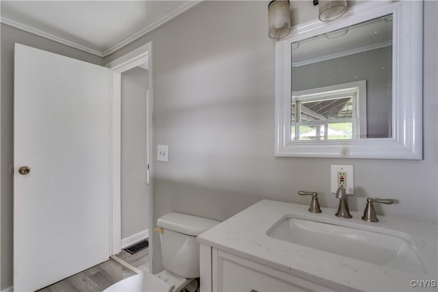 124 Haven St, Watertown-City, NY 13601 - bathroom featuring crown molding, toilet, wood finished floors, and vanity