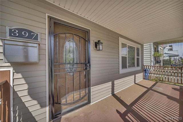 397 14th St, Buffalo, NY 14213 - view of exterior entry featuring covered porch