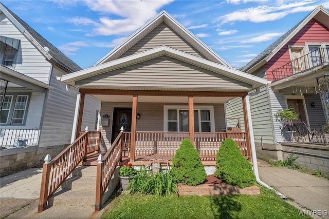 397 14th St, Buffalo, NY 14213 - shotgun-style home featuring a porch
