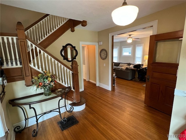 536 Potomac Ave, Buffalo, NY 14222 - foyer featuring wood finished floors, stairs, baseboards, and a ceiling fan