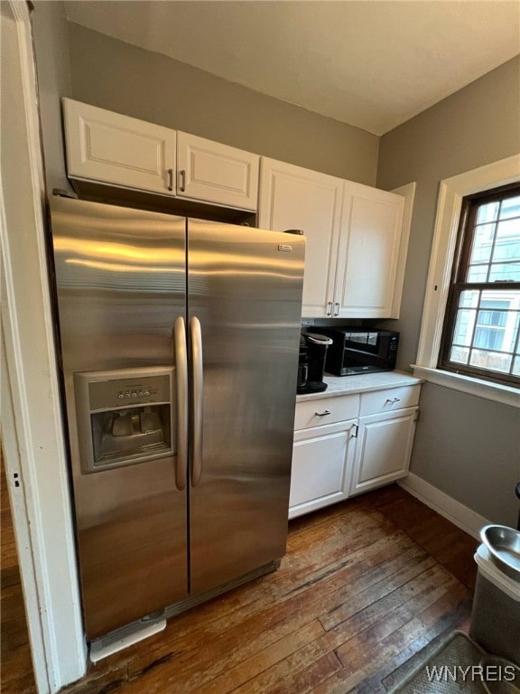 536 Potomac Ave, Buffalo, NY 14222 - kitchen featuring stainless steel refrigerator with ice dispenser, dark wood finished floors, and white cabinets