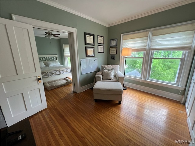 536 Potomac Ave, Buffalo, NY 14222 - living area featuring baseboards, ornamental molding, plenty of natural light, and wood finished floors