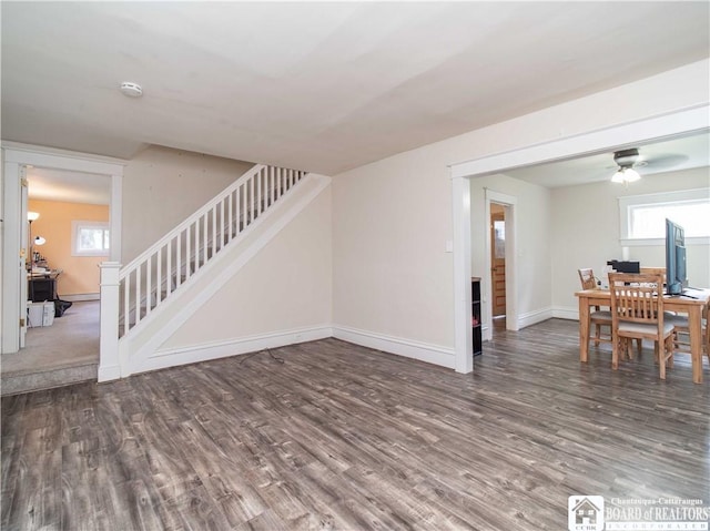 78 Benson St, Jamestown, NY 14701 - unfurnished living room with stairway, wood finished floors, baseboards, and ceiling fan