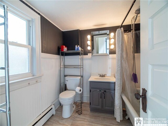 78 Benson St, Jamestown, NY 14701 - bathroom with a baseboard heating unit, toilet, shower / bath combo with shower curtain, and plenty of natural light