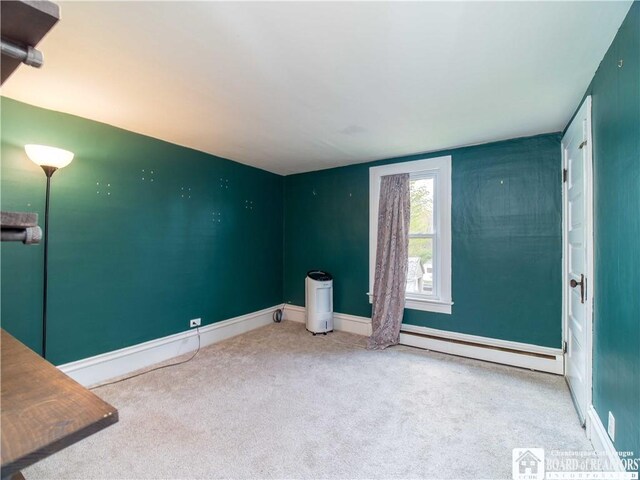 78 Benson St, Jamestown, NY 14701 - carpeted empty room featuring baseboard heating and baseboards