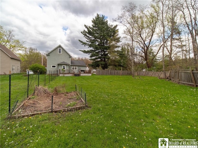 78 Benson St, Jamestown, NY 14701 - view of yard featuring a vegetable garden and a deck