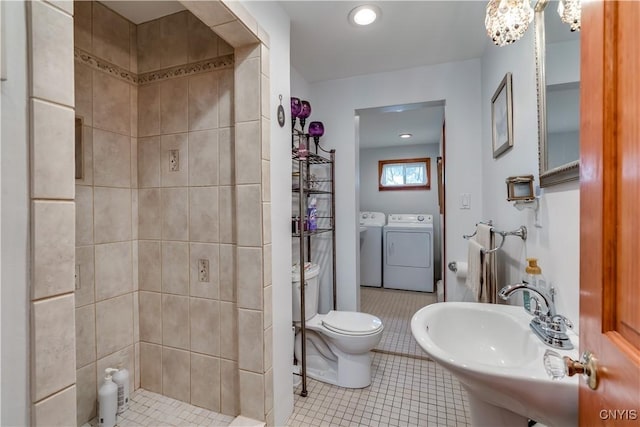 bathroom featuring separate washer and dryer, a sink, tile patterned flooring, toilet, and recessed lighting