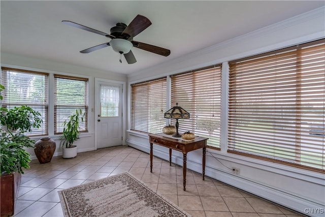 sunroom featuring a baseboard heating unit