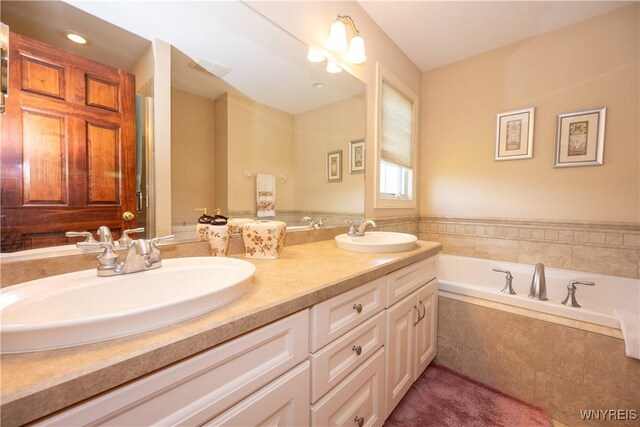 5067 William St, Lancaster, NY 14086 - bathroom with double vanity and a bath
