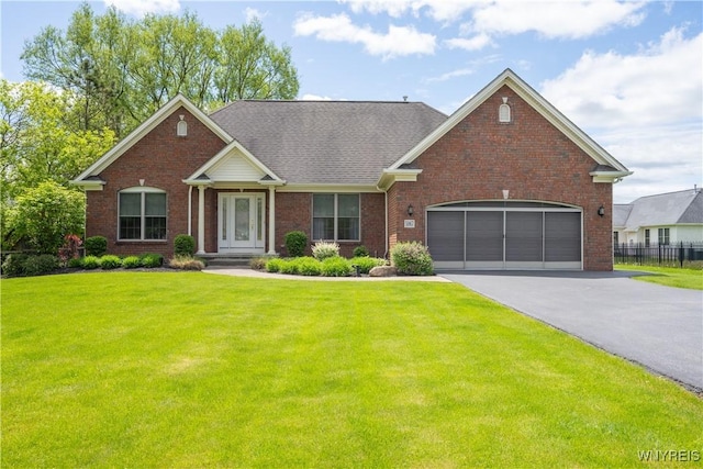 5067 William St, Lancaster, NY 14086 - view of front of property featuring driveway, brick siding, and an attached garage