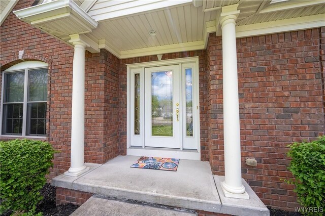 5067 William St, Lancaster, NY 14086 - property entrance with brick siding and covered porch