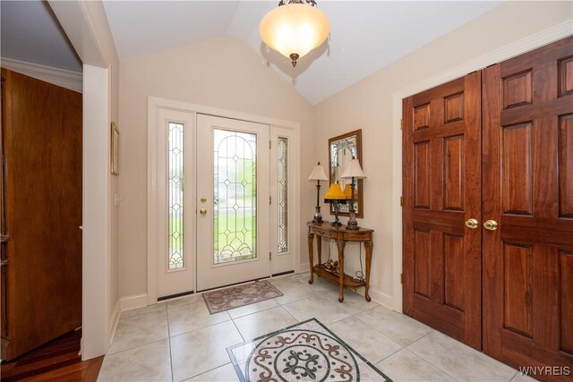 5067 William St, Lancaster, NY 14086 - entrance foyer featuring lofted ceiling, baseboards, and light tile patterned floors