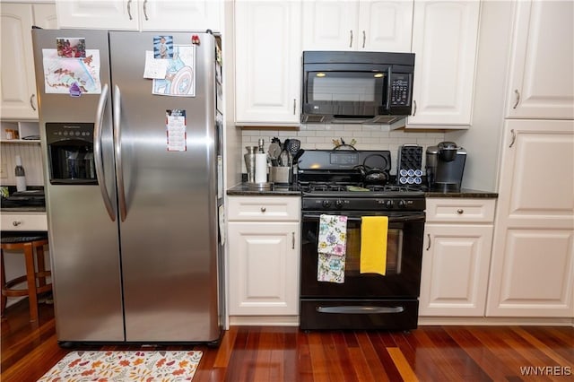 5067 William St, Lancaster, NY 14086 - kitchen featuring black appliances, dark wood finished floors, white cabinetry, tasteful backsplash, and dark stone countertops