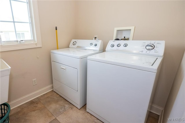 5067 William St, Lancaster, NY 14086 - washroom featuring washing machine and clothes dryer and baseboards