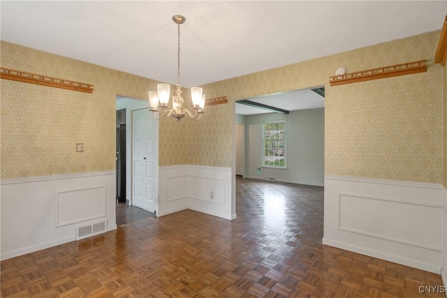 4646 Cranapple Dr, Marcellus, NY 13108 - unfurnished dining area featuring wallpapered walls, a chandelier, wainscoting, and baseboards