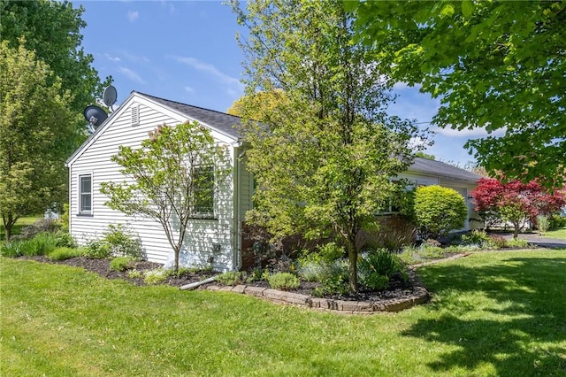 view of home's exterior featuring a lawn