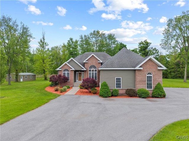 1210 Lake Rd, Oneida-Outside, NY 13421 - view of front of property with brick siding, a front lawn, and roof with shingles