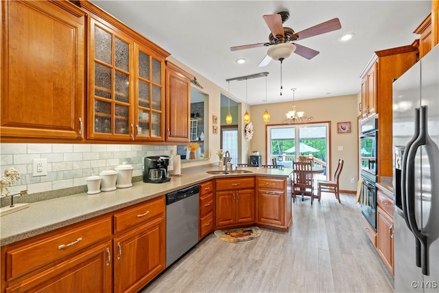 1210 Lake Rd, Oneida-Outside, NY 13421 - kitchen with stainless steel appliances, a sink, light wood-style floors, brown cabinetry, and recessed lighting