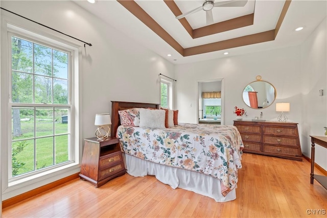 1210 Lake Rd, Oneida-Outside, NY 13421 - bedroom with multiple windows, light wood-style floors, and a raised ceiling