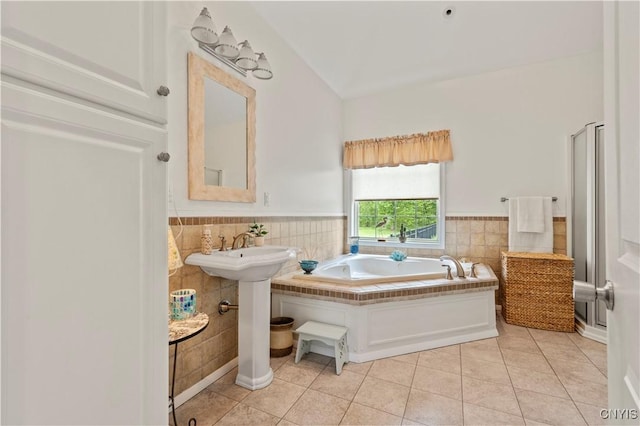 1210 Lake Rd, Oneida-Outside, NY 13421 - full bath with tile walls, tile patterned floors, wainscoting, and a bath