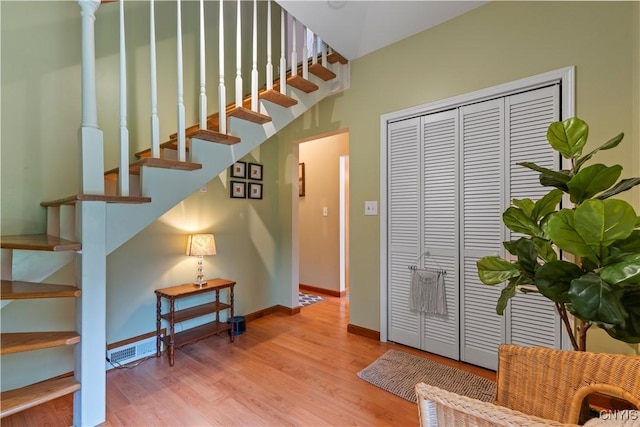 1210 Lake Rd, Oneida-Outside, NY 13421 - staircase with wood finished floors and baseboards