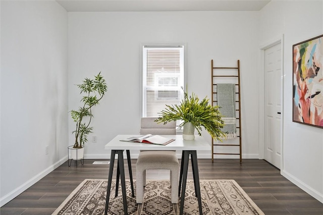 dining area with dark wood finished floors, an office area, and baseboards