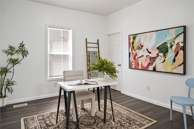 office area featuring dark wood-style flooring and baseboards