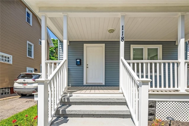 doorway to property featuring covered porch