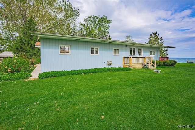 4609 E Lake Rd, Wilson, NY 14172 - back of house featuring a lawn and a deck with water view