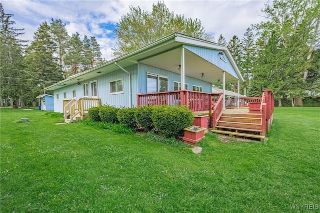 4609 E Lake Rd, Wilson, NY 14172 - back of property featuring a deck and a lawn