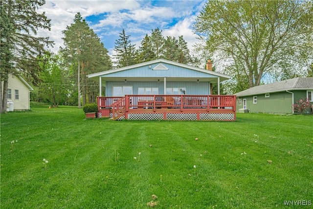 4609 E Lake Rd, Wilson, NY 14172 - back of property with a deck, a yard, and a chimney