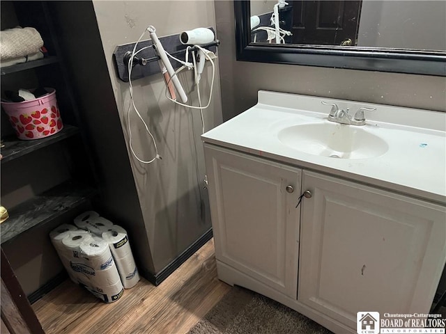 319 Ericsson Rd, Poland, NY 14747 - bathroom featuring wood finished floors and vanity