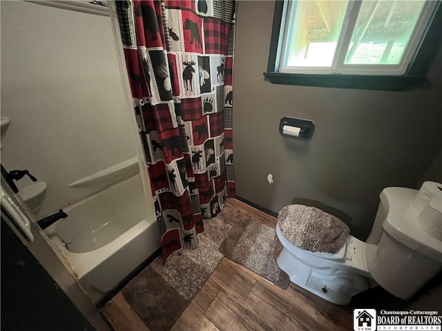 319 Ericsson Rd, Poland, NY 14747 - bathroom with toilet, wood finished floors, and shower / bath combo