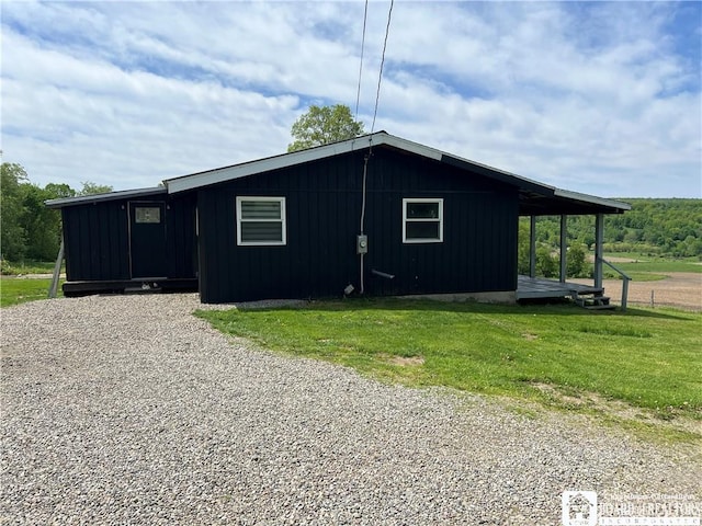 319 Ericsson Rd, Poland, NY 14747 - view of side of property with a yard and board and batten siding