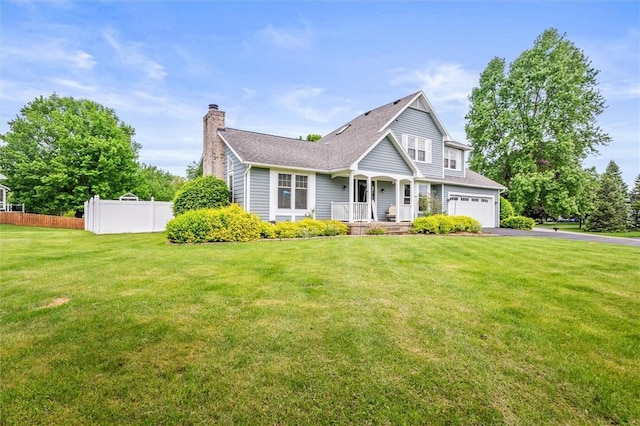 traditional home with a chimney, driveway, roof with shingles, and a porch