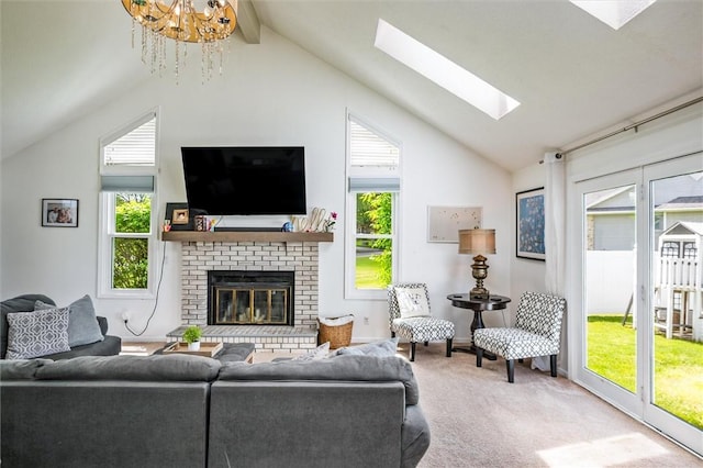 carpeted living room featuring a skylight, a fireplace, a chandelier, high vaulted ceiling, and beam ceiling